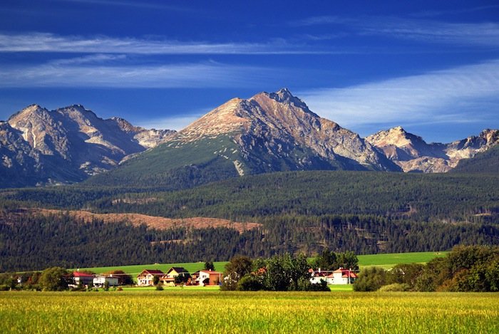 A view of The Tatra Mountains and village in summer, Slovakia.